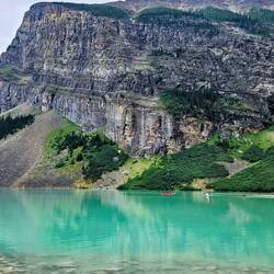 Canoes at far end of Lake Louise