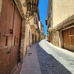 literally "up" the street