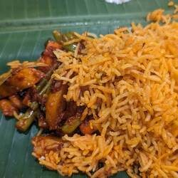 Delicious biryani which was served to me out of a huge bamboo shoot!