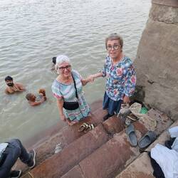 Feet in the very warm and slightly dirty Ganges