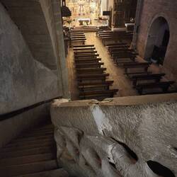 The stairs going down from the balcony