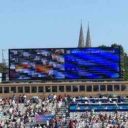 Big screens show the standings