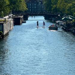 People SUP-ing in tha canal