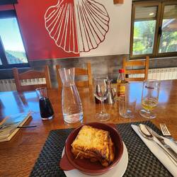 supper time at the alberque in Tosantos. The lasagna 1st course. 2nd course: meatballs, ff, salad