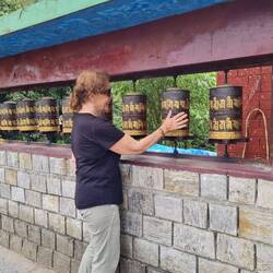 Jane getting some good wishes in for safe travels from the Budhist wheels