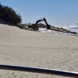 Beach renourishment using water to carry sand from dunes onto Maroochydore Beach