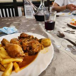 Chicken legs and fries main meal, with salad