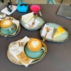 Cappuccino and pastries for the road. Caramel cheesecake and chocolate chip ricotta slices