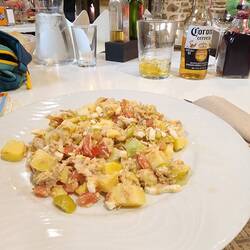 Supper time: salad with potatoes, tuna, tomatoes, cucumber, egg, olives