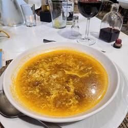 Their specialty soup: onion, garlic, bread, eggs. A cross between egg drop soup and onion soup.