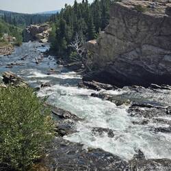Waterfall where the Swiftcurrent river leaves the lake