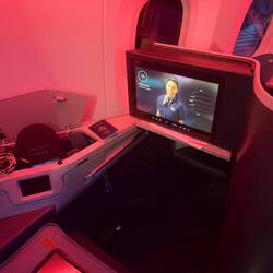 The cabin ambience on board AA151 at boarding. I was surprised to board a darkened cabin.