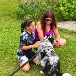Family of girls fishing nearby