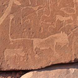 Der Löwe mit Hand am Ende des Schwanzes, der einen Schamanen darstellen soll