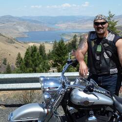 Funny story, the road ran into that lake you can see behind me, there was a ferry to take us across