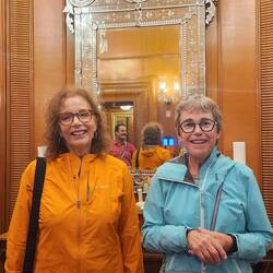 2 beautiful girls with the amazing.mirror behind