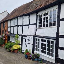 Cute timber framed houses with a banner commemorating the War of Roses