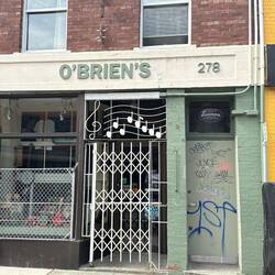 The notes over the door of this music store begin the song, Ode to Newfoundland