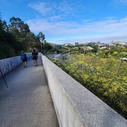 Long, concrete path into the city