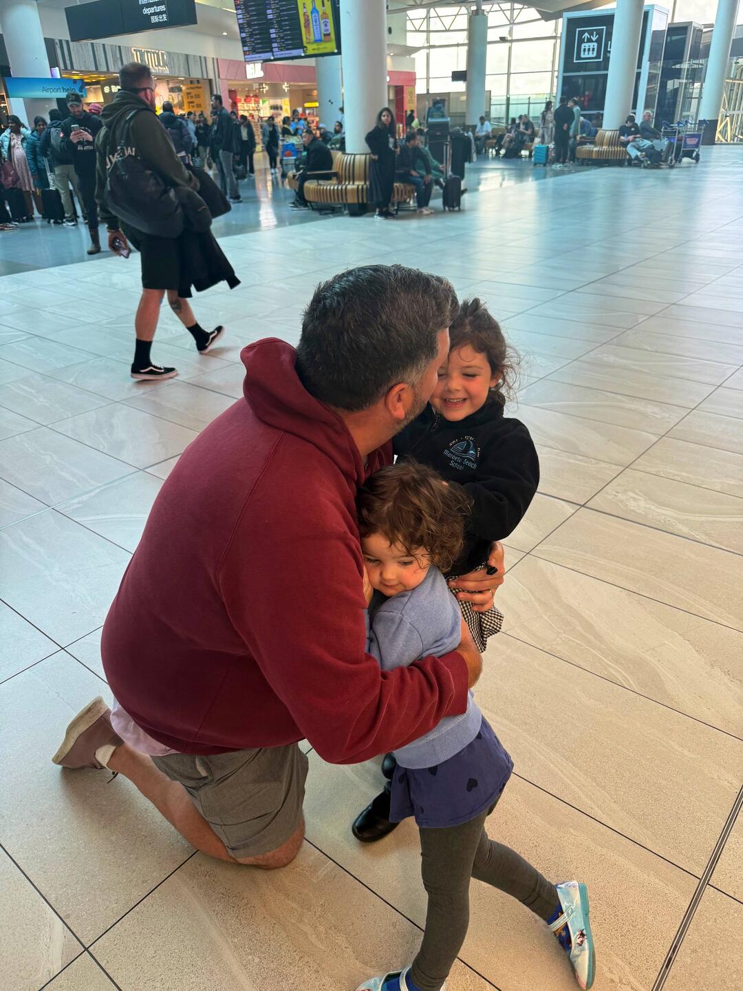 A tough goodbye with the girls at Auckland Airport