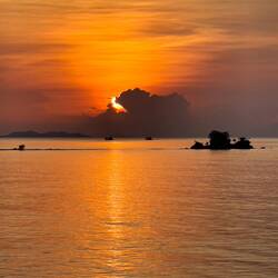 There comes the sun ... Insignia docked at the Deep Sea Port in Phuket, Thailand.