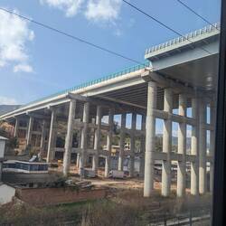 An 8 lane highway bridge from below.