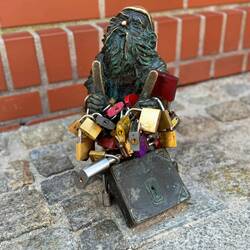 Anti-Locks of Love dwarf. Has a sign telling you NOT to put locks on bridge