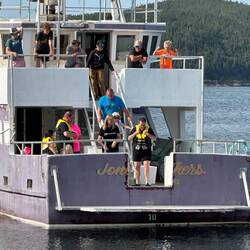 Jumping into the Atlantic to raise much-needed funds.