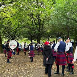 Scotch A band practising under the trees at Glasgow Green.