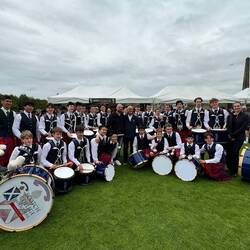Scotch A& B bands perform in front of Jim Kilpatrick's tent ( drumming supplies). Jim is Hugo's hero