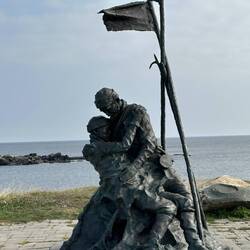 Evocative memorial of father holding his dead son