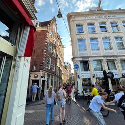 Hard to see, but the brown building on the left tips out to allow for goods to be hoisted up