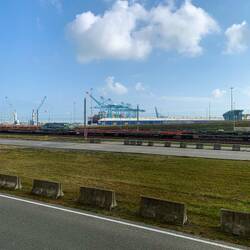 Modern shipping port next to train station