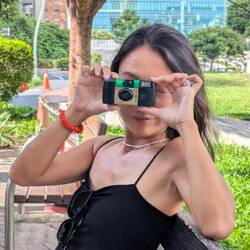 Vela trying her disposable camera on for size