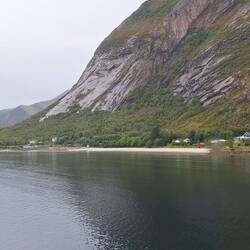 The ship sails pretty close to the coastline