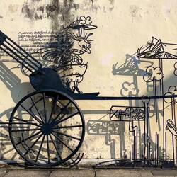 Mural explaining that Cannon St got its name from a cannot-shot fired here in 1867 — George Town.
