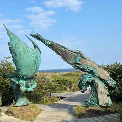 Sculpture is named "Meeting of Two Worlds"