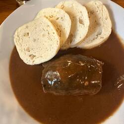 Czech bird, sliced sirloin wrapping sausage and veggies in mushroom sauce