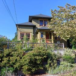 This is our Airbnb (Upstairs); house is typical Seattle style. Gorgeous garden!