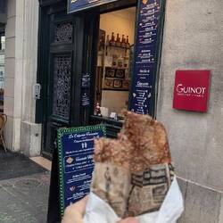 You buy food from the man in the window and eat it on the street