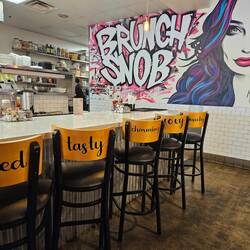 The backs of the chair all had fun words on them to complement the mural and restaurant vibe