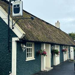 Thatched roof Dollys Pub