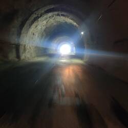 Absolutely creepy and dark tunnel with only one little light in the middle