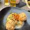 Bacon dumplings with sauerkraut topped with fried onions