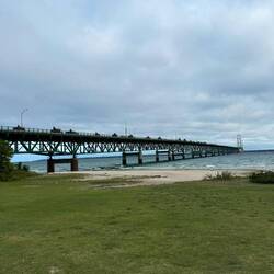 Tractors crossing the bridge. Lake Huron on right. Lake Michigan on left.