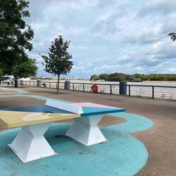 Aesthetic ping pong tables all along the water