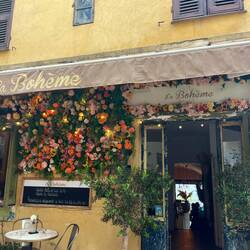 Delightful cafe/restaurant with religious effigy present on many buildings