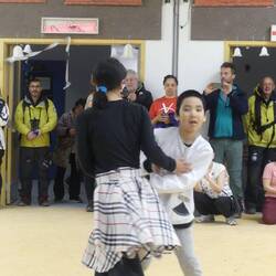 a demonstration of square dancing by the youngsters