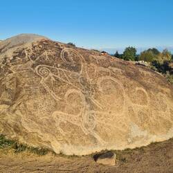 Petroglyphs - some are a bit ridiculous but this is a hunter chasing a deer with snow leopards