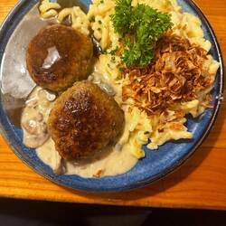 Meatballs, spaetzel, mushroom sauce and crispy onions
